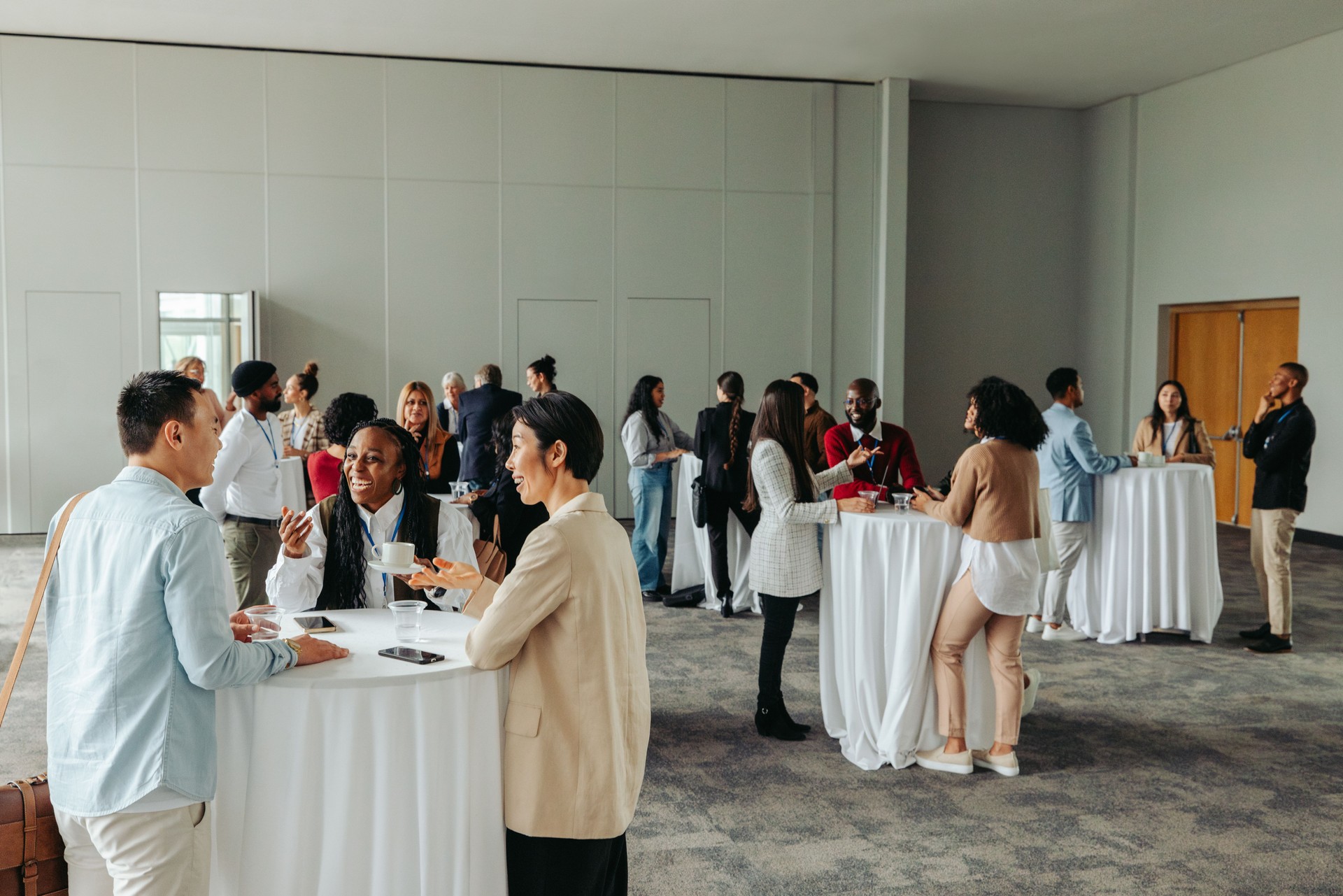 Diverse professionals networking and socializing at a business event